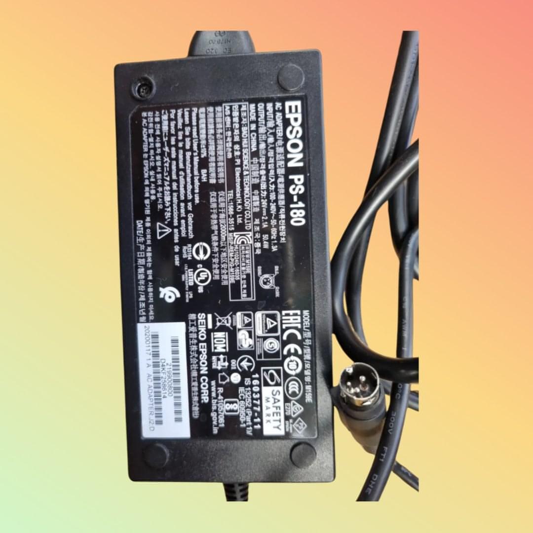 Complete packaging of Epson PS-180-24V adapter with user manual.