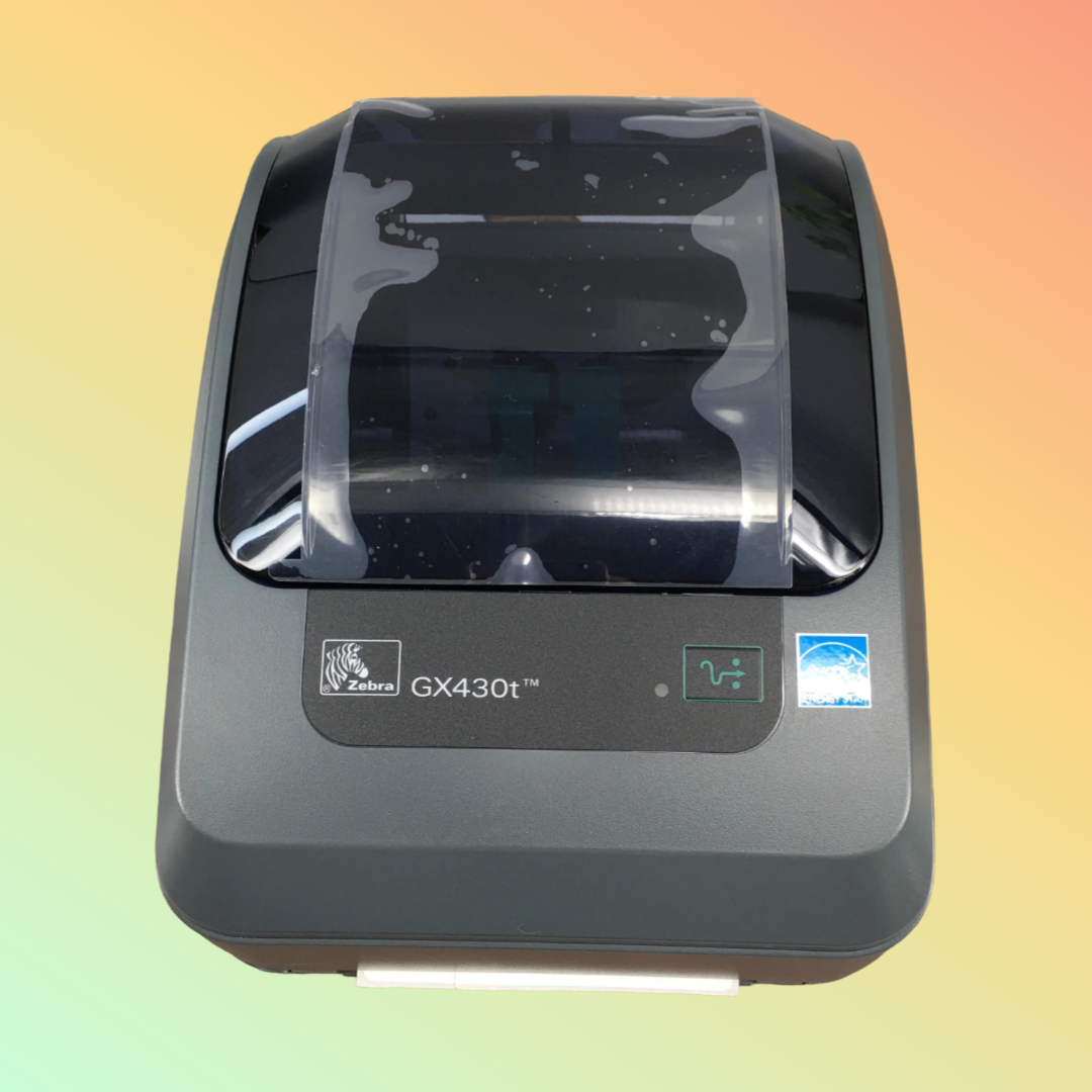 Close-up of GX430t printing a 1D barcode on a label
