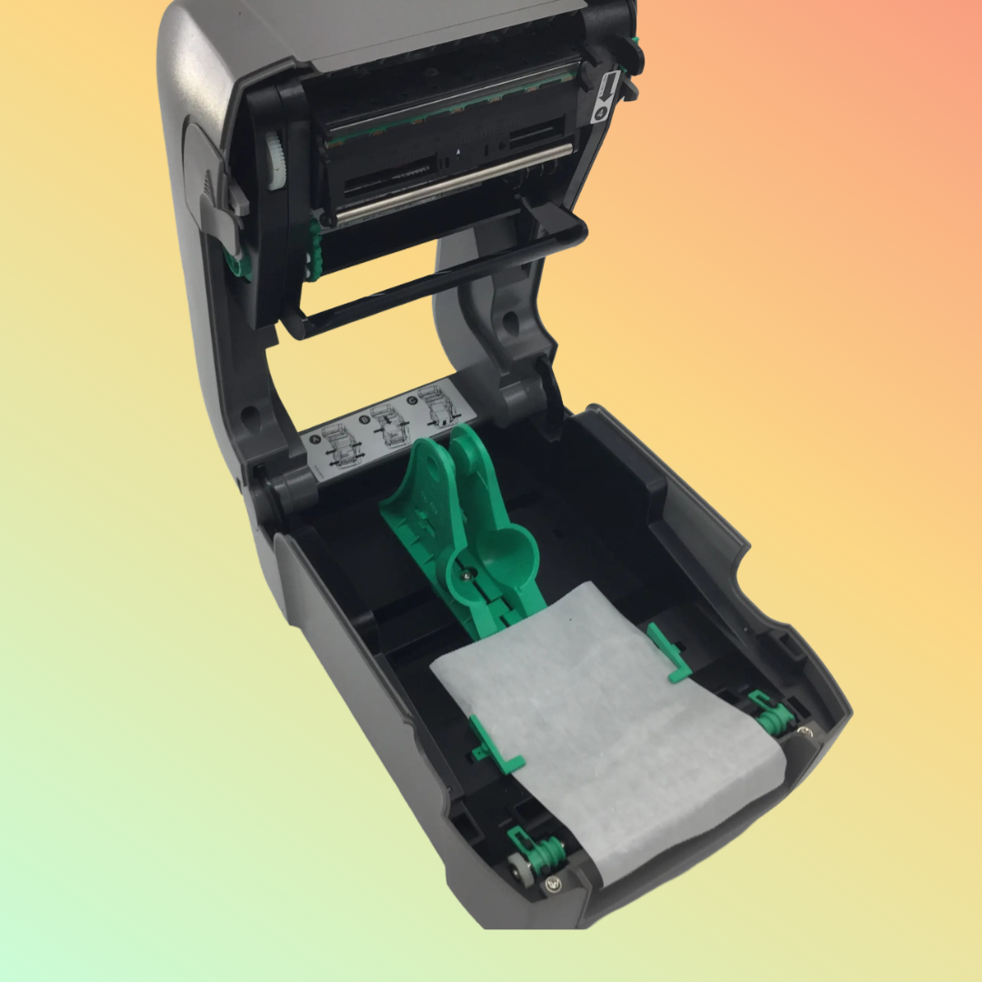 Front view of the DATAMAX E4205A printer with label loading tray open
